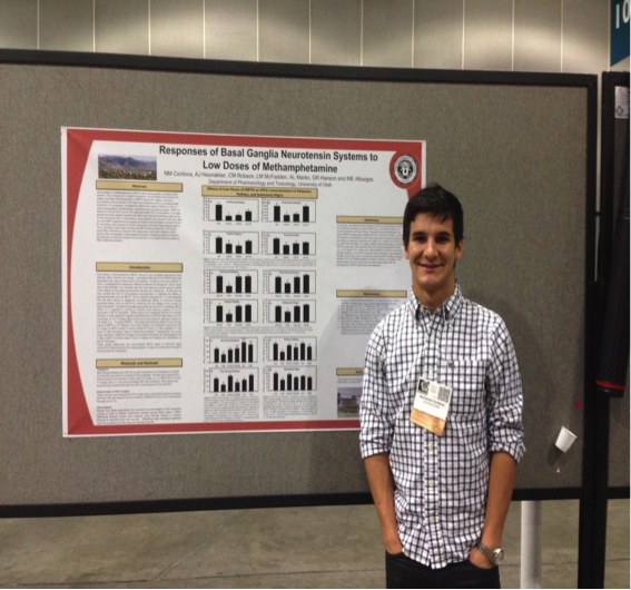 Nathaniel Cordova in front of poster 2014