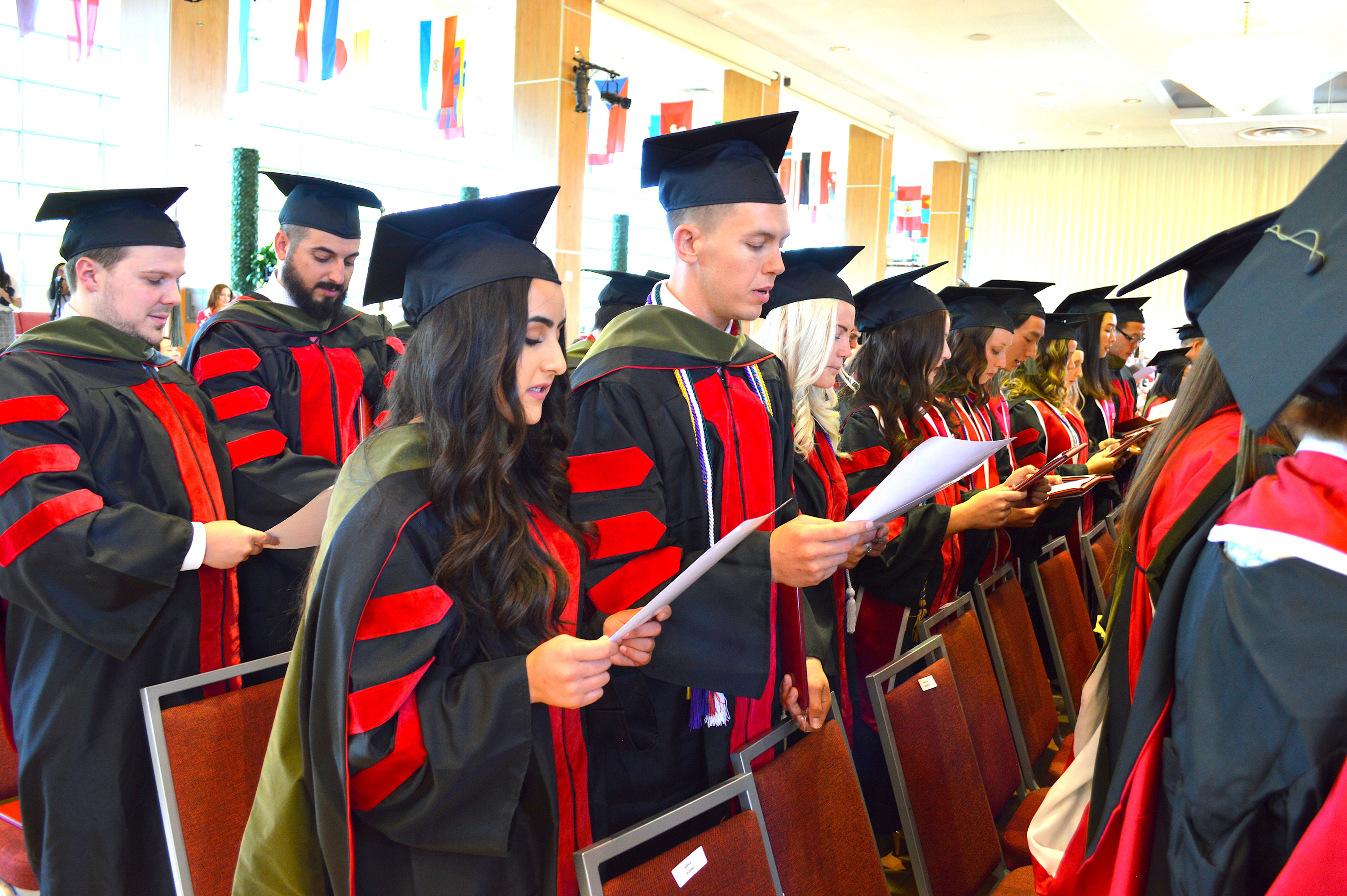 Class of 2018 Convocation graduates reading oath