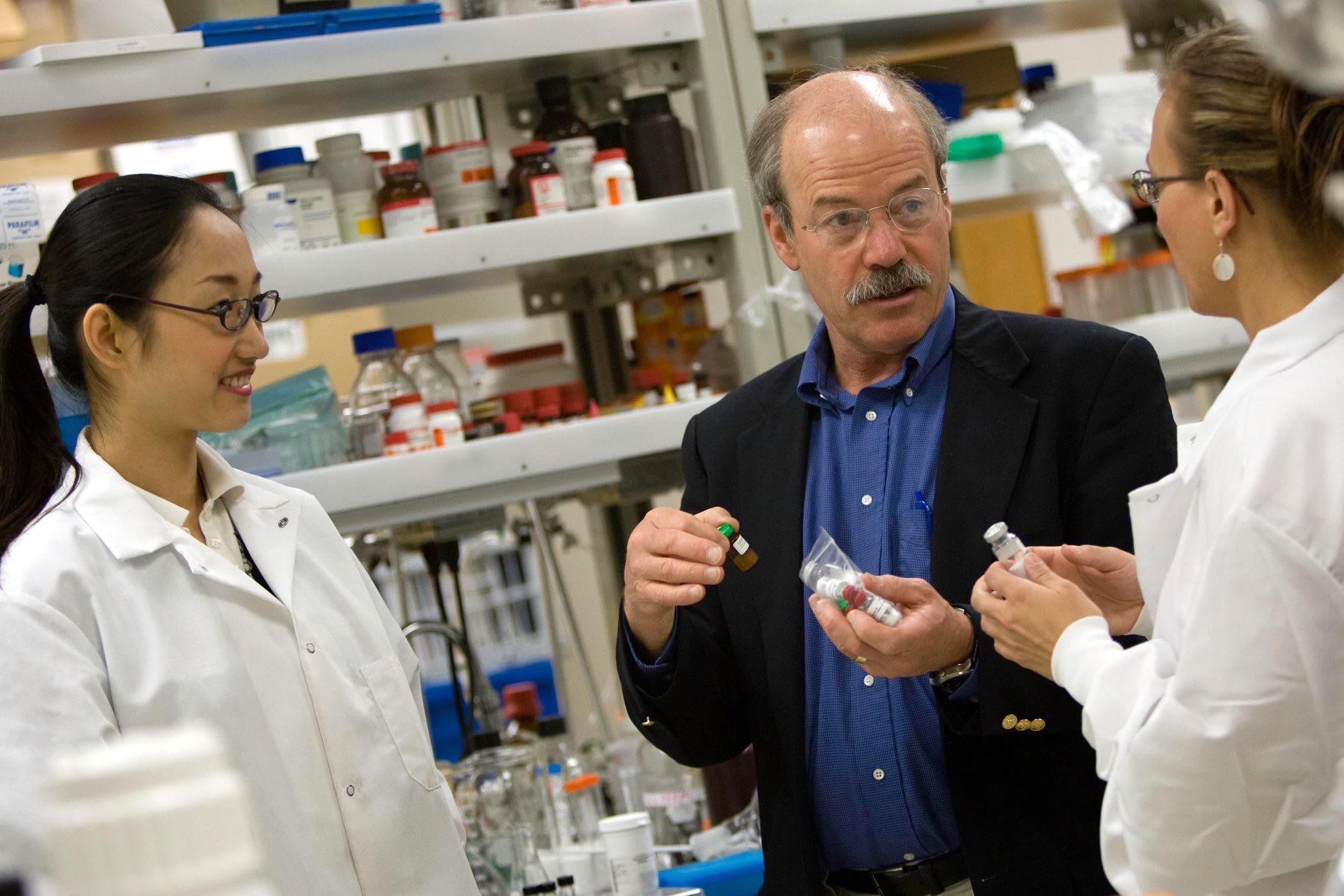 Glenn Prestwich in lab with other researchers