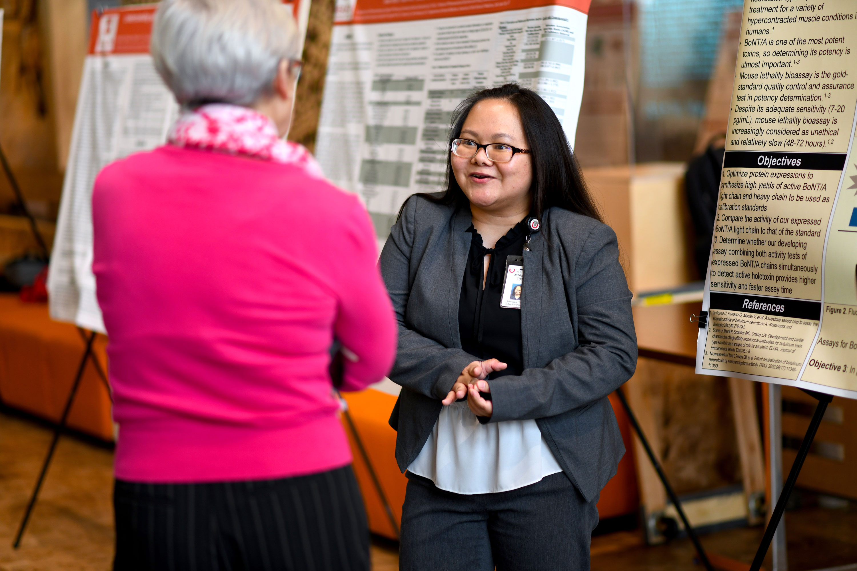 woman explaining poster