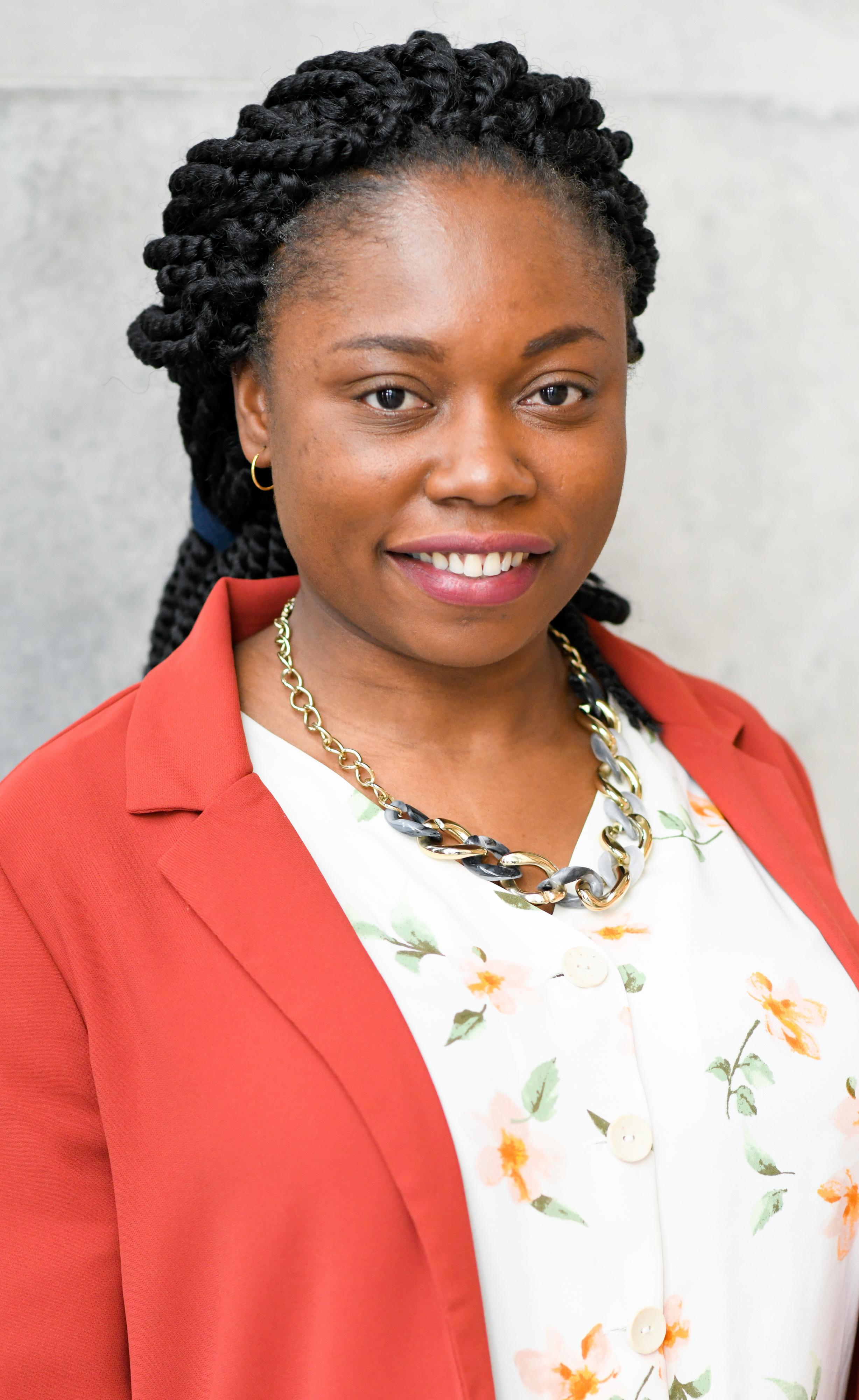 Amaka Nwagbo featured on a gray background