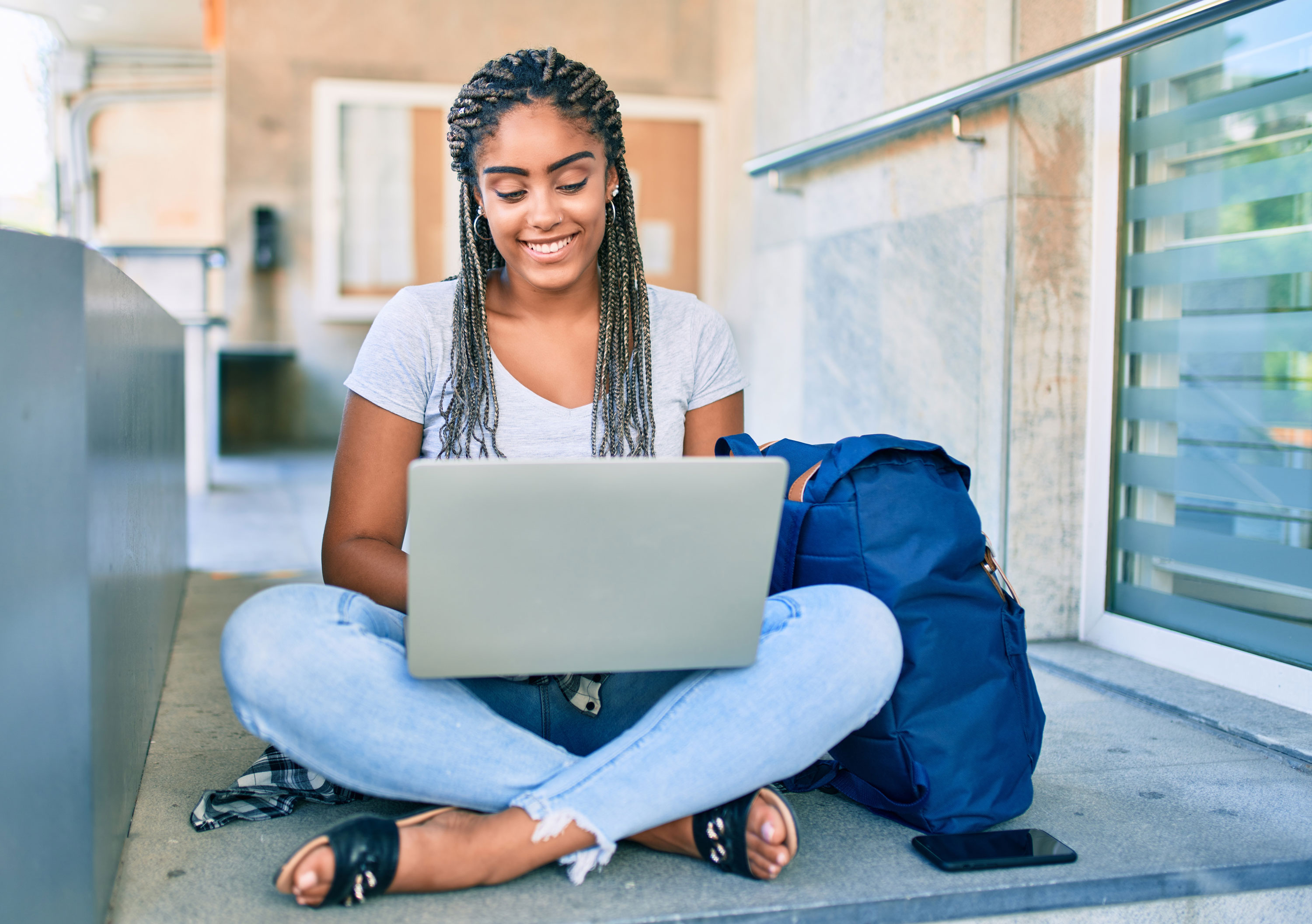 student looking at her computer