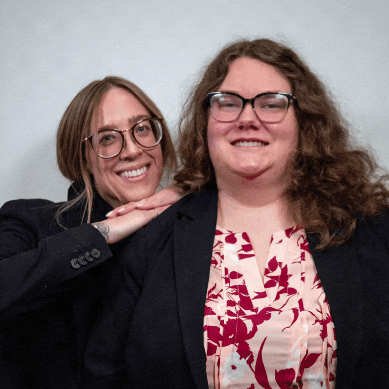 Lizabeth Cowgill and Sierra Schippers Smile and Pose like their Podcast Cover.