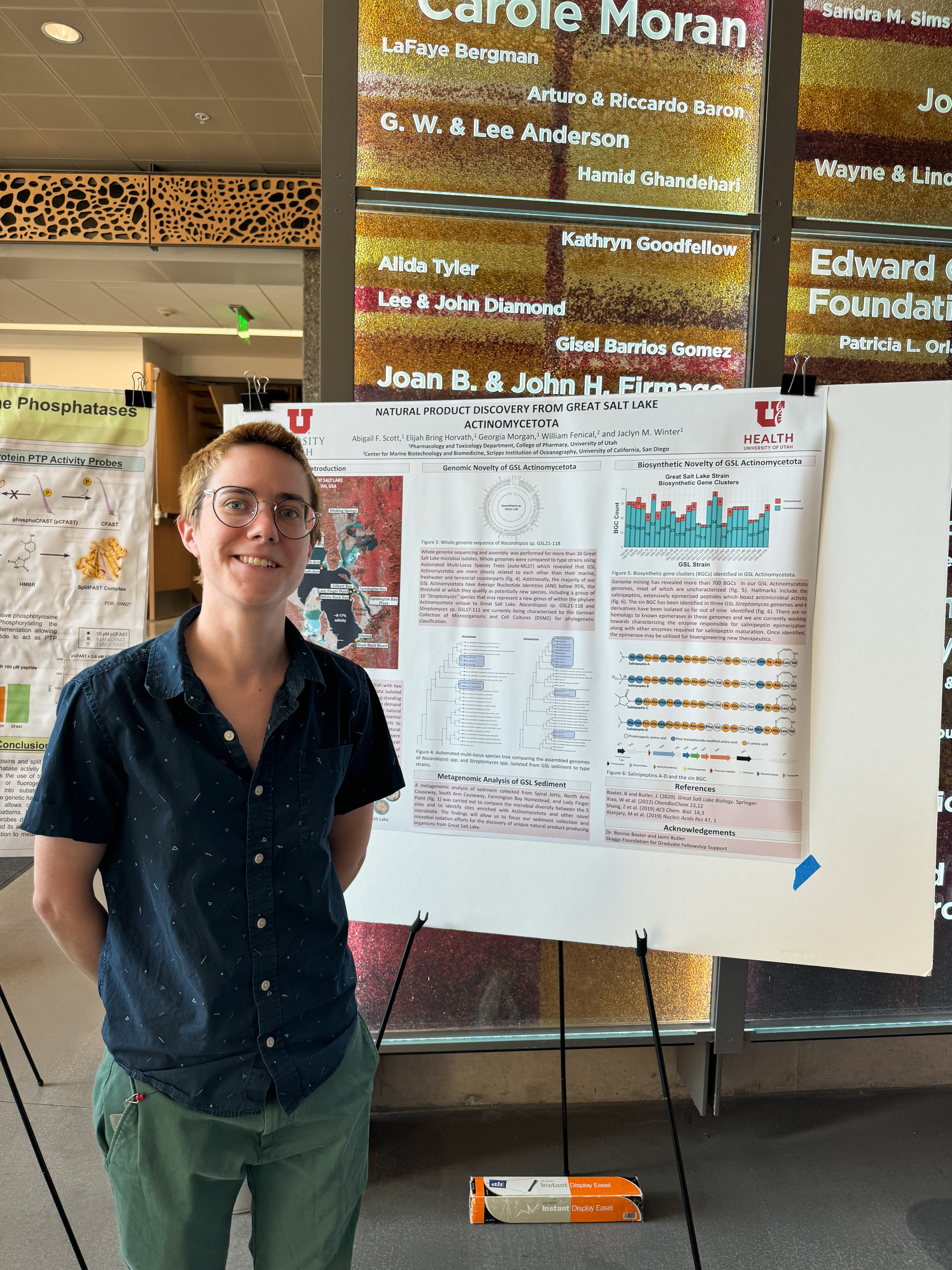 Abby Scott standing in front of her poster