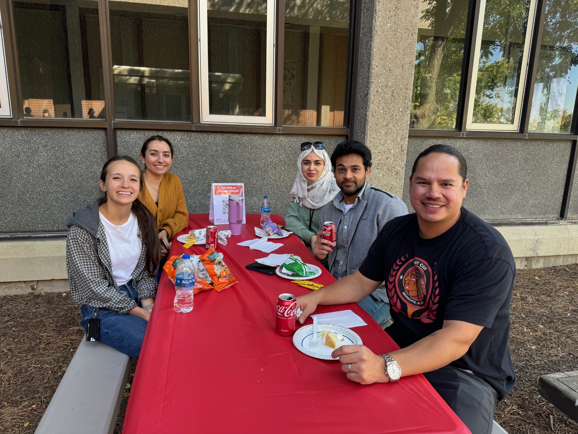 5 trainees at outdoor apts event