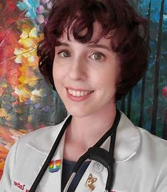 Ashley in front of a colorful background