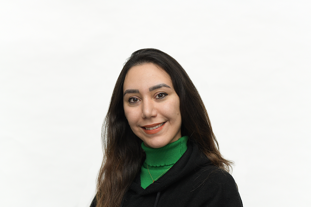 A woman featured smiling on a white background