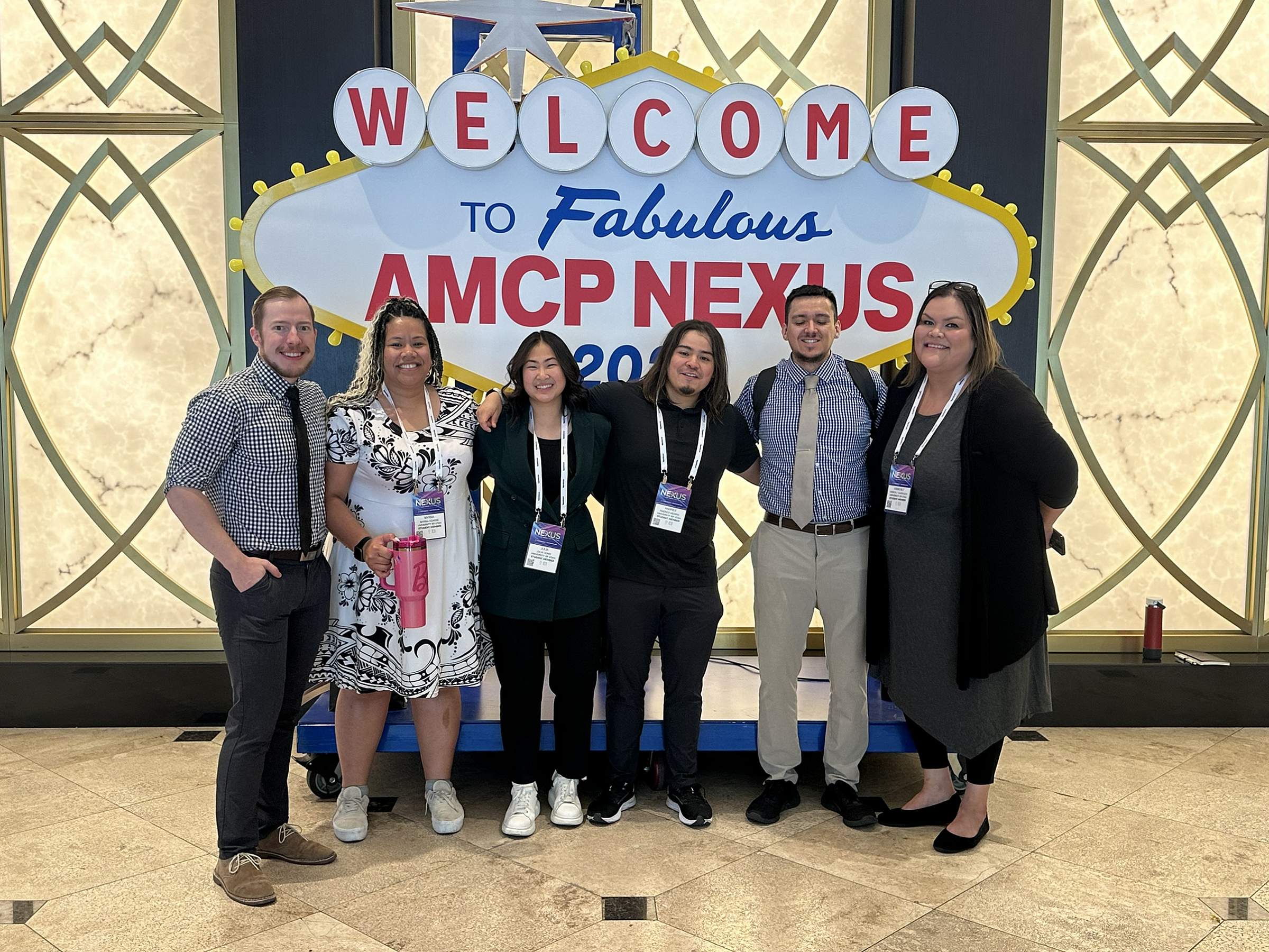 P3 students pose in front of AMCP Nexus Conference sign, Las Vegas, Nevada. (October, 2024)