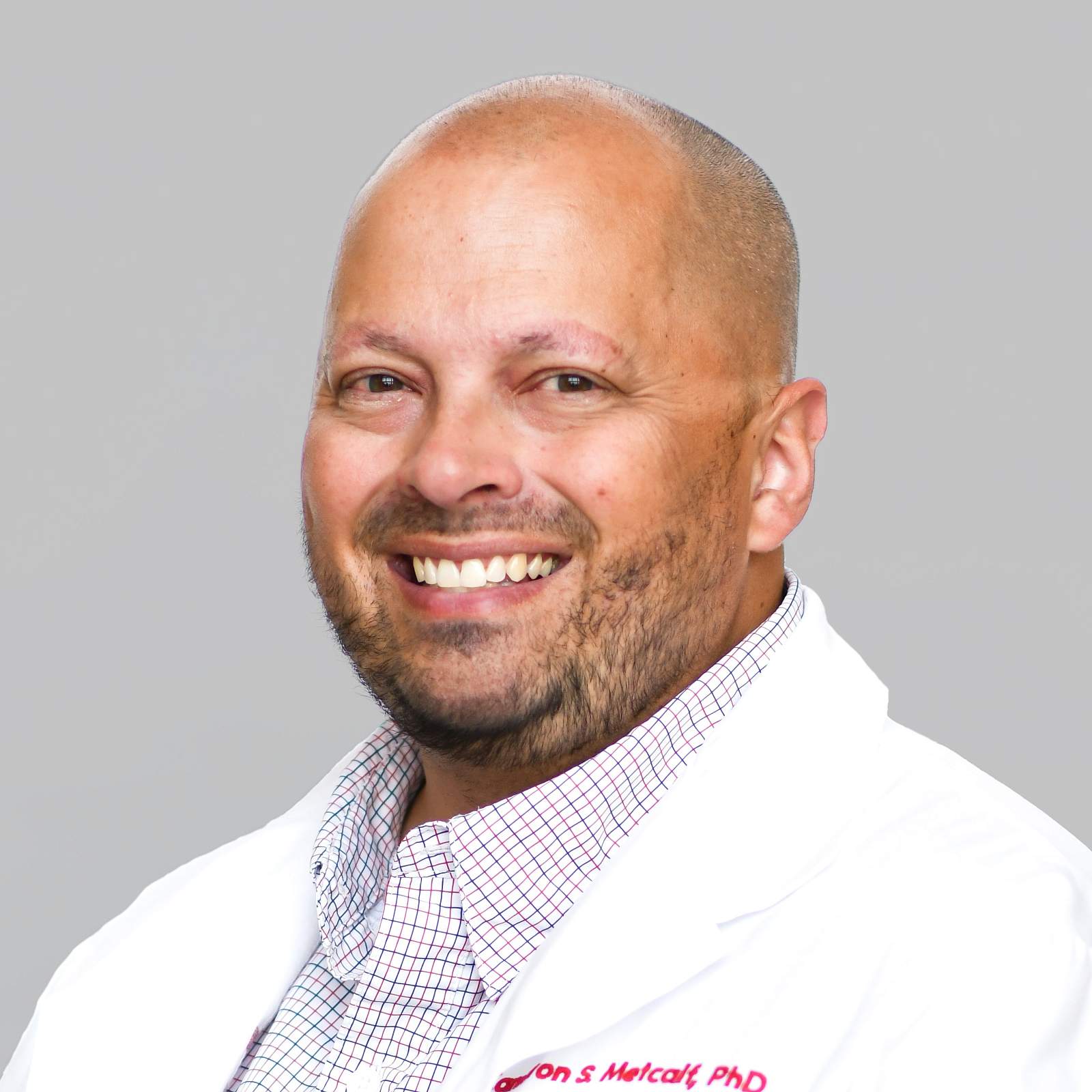 Dr. Cameron Metcalf headshot