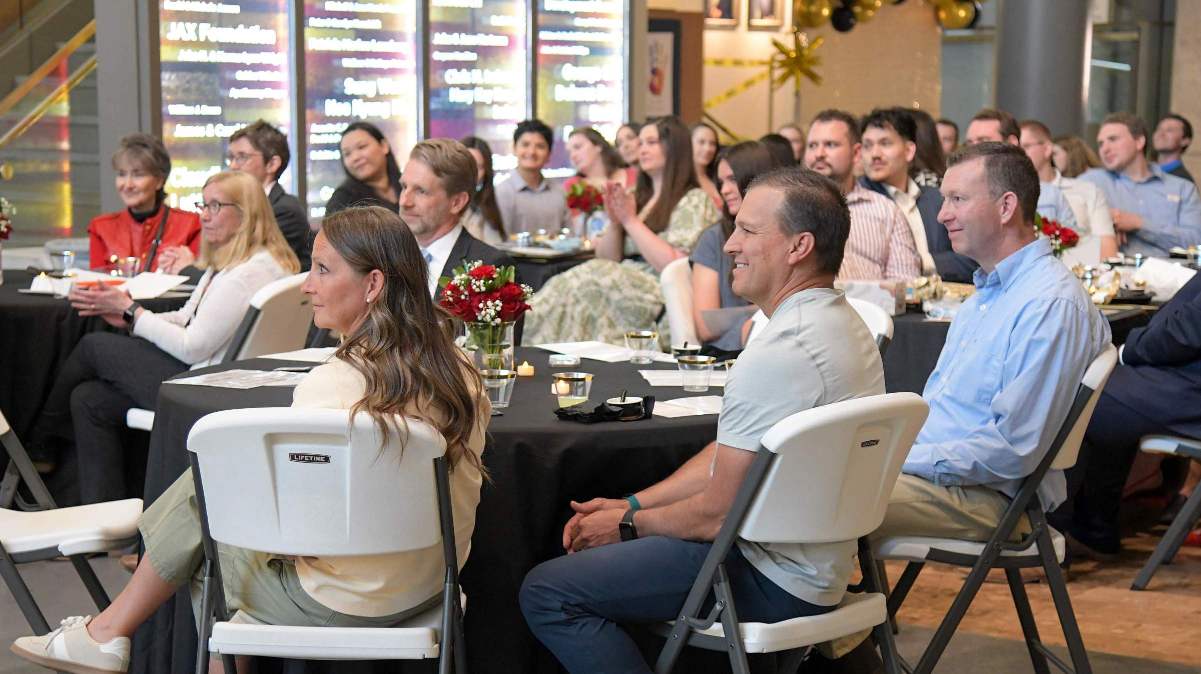 Preceptor Awardees watch on from their Distinguished Guest table as they're introduced and honored. (May 7, 2025)